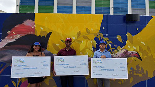 three secme scholarship winners holding checks in wynwood, miami