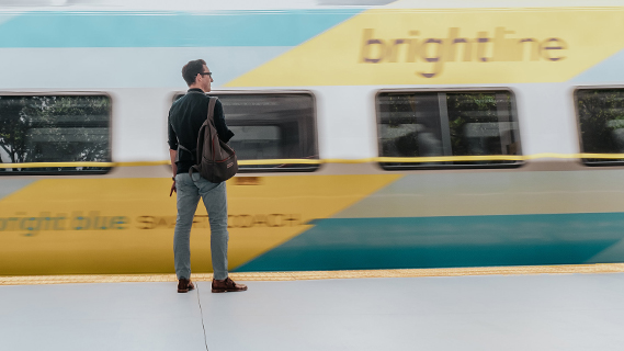 Man standing at the Brightline station