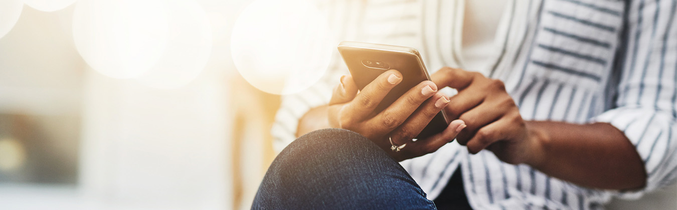 Hands holding a mobile device