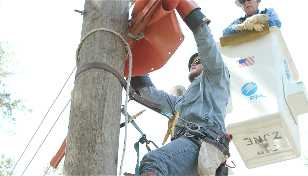 FPL line workers climbing pole and inspecting from bucket