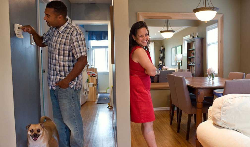 Couple at home with dog