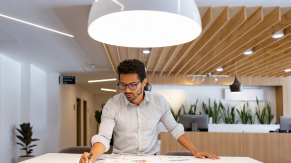 man working at drawing desk