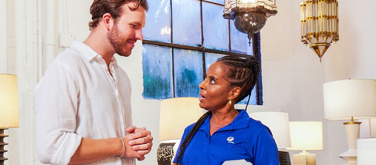 an energy advisor explaining the on call device to a business owner
