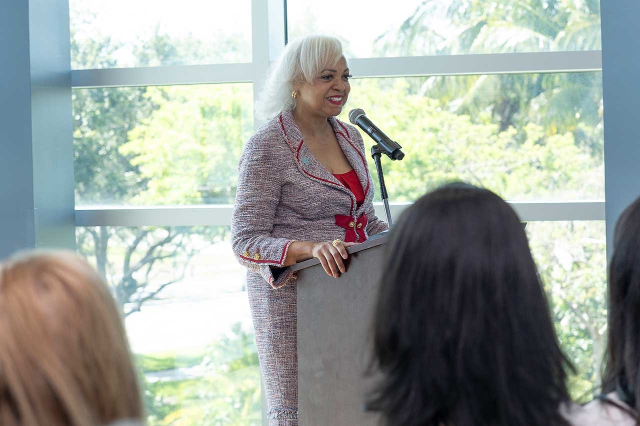 FPL employee speaking at FAU podium