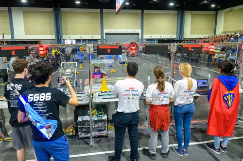 A robotics team operating robots.