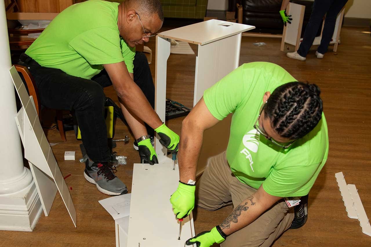 Volunteers putting furniture together