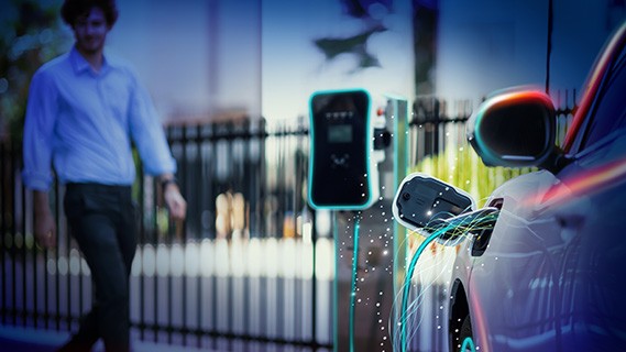 an electric vehicle connected to a third party charger