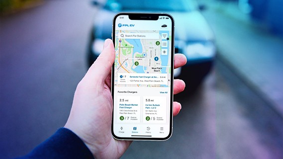 hand holding a phone displaying fpl evolution app ev charger location and map screen