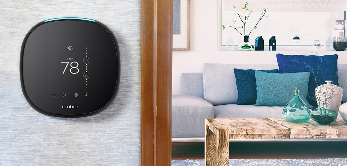 Smart thermostat on a wall set to 78 degrees