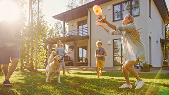 family playing in yard
