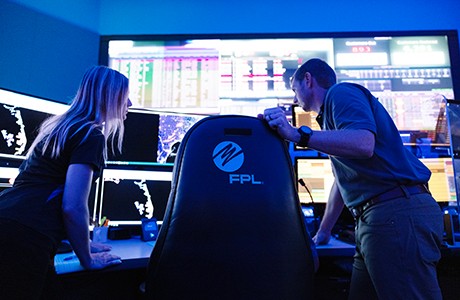 two people in command center