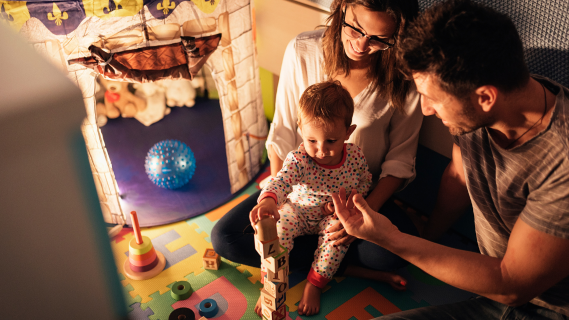 parents playing with child