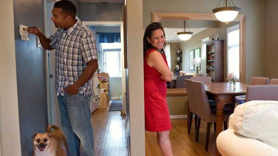 Couple at home with dog
