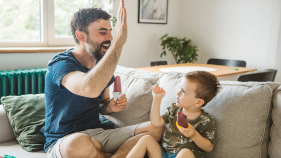 man and child giving a high five