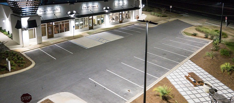 aerial view of a well-lit parking lot of a business