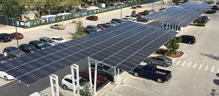 aerial view of a parking lot with a solar canopy