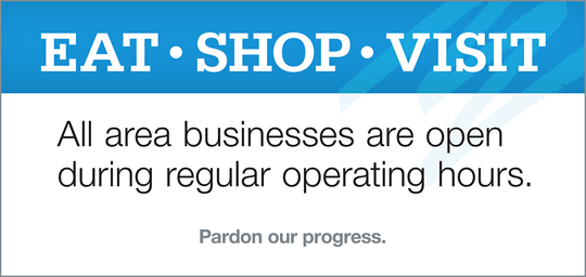 Pardon our progress sign used during downtown Pensacola underground work informing area businesses are open