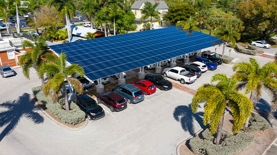 aerial view of a covered parking lot area with solar panels