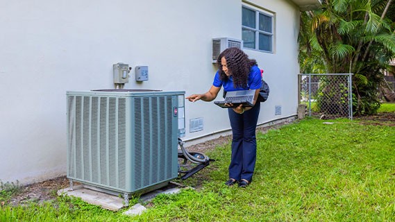 an a/c unit outside a brick home