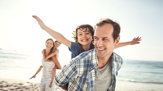 a family spending time together at the beach
