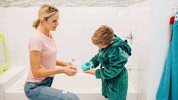 woman and boy during bath time