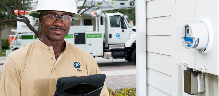 FPL worker checking a smart meter