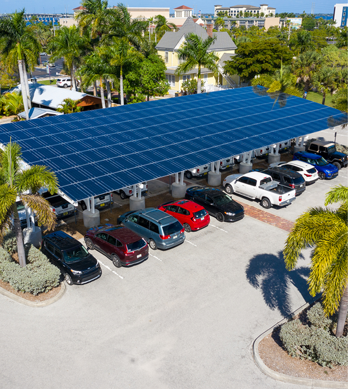 cars parked beneath punta gorda city hall solar canopy